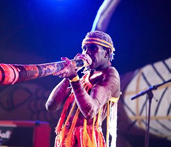 Indigenous Man Playing Didgeridoo