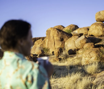 Man looking at rocks