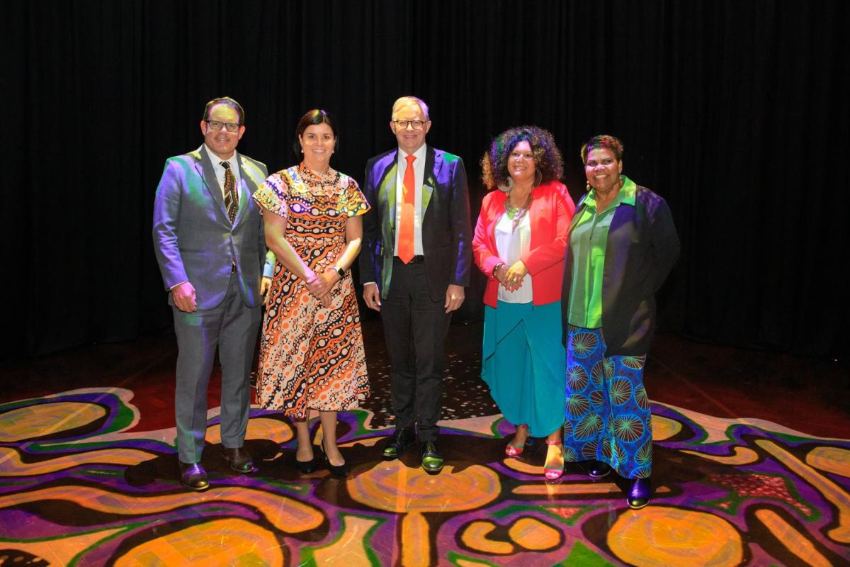 Member for Solomon Luke Gosling, NT Chief Minister Natasha Fyles, Prime Minister Anthony Albanese, Senator for the NT Malarndirri McCarthy and Member for Lingiari Marion Scrymgour at Facing North, Parliament House standing on Parrtjima installation Grounded.