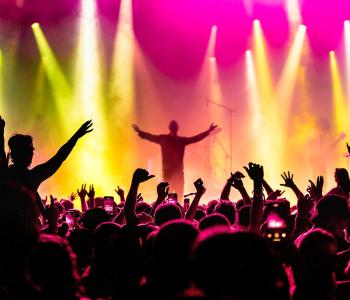 A crowd in front of a music stage